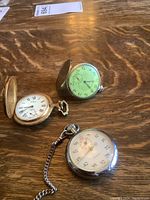 Overview of three watches on table