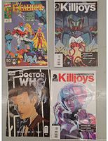 Four comic books laid out showing front covers: Excalibur #36, two Killjoys comics, and Doctor Who #10