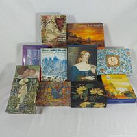 Front view of eleven boxed notecard sets