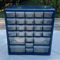 Front view showing all 27 clear drawers in dark blue frame