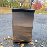 Front view showing stainless door with dents