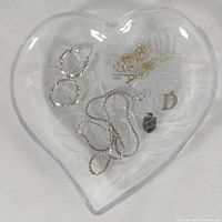 Top view of heart crystal dish and all jewelry pieces