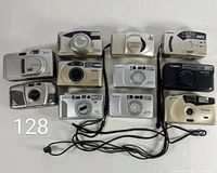 Overview of all eleven 35mm point-and-shoot cameras with attached straps