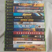 Stack of 16 Xbox game spines showing titles