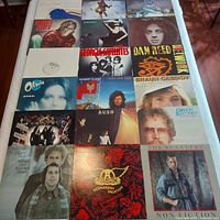 Full grid of 18 album covers