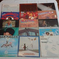 Overall shot of 15 album covers laid out