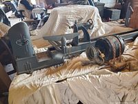 Full view of grey cast iron lathe bed, drive motor mounted separately