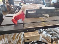 View of the router table surface showing safety guard and control switch.