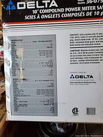 Box label showing model details, specifications and manufacturer info for Delta 10 compound power mitre saw Model 36-075C.