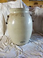 Full view of tall off-white ceramic pickle barrel with metal handles, showing number 8 Imperial mark on upper body.