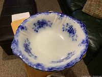 Top view showing the interior blue floral mottled pattern and scalloped rim of the antique flow blue serving bowl.