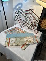 Photo showing the pillowcases and metal wall art on a table, highlighting fabric pattern and metal design