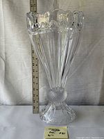 Front view of tall Shannon Crystal vase with measuring tape showing 16 inches height and 8 inches width, placed against a neutral background.