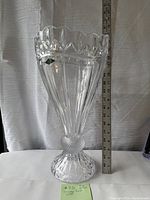 Full view of the vase with measuring stick showing approximately 16 inches tall.