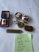 Top down image showing all pill cases arranged with handwritten note describing lot contents