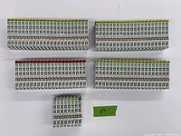 Top view of six KL bus terminal modules showing connector pins and terminal points, arranged on white background, for cataloging Beckhoff I/O components.