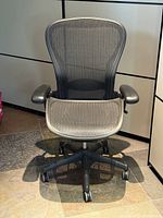 Front view of large Aeron chair showing seat, arms and casters