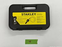 Closed black Stanley carrying case with yellow label indicating inspection camera contents and brand.