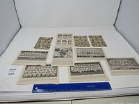 Full view of all 9 paper items laid flat, including team photos and clippings