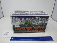Photo of the original box of the 2007 Hess Monster Truck with Motorcycles showing branding and artwork.
