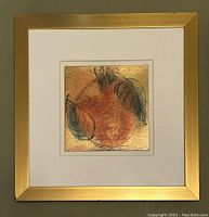 Full front view of framed gold leaf abstract art under glass