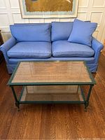 Front view of coffee table positioned before a sofa