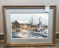 Full view of the framed print showing the entire winter barn scene in a wooden frame.