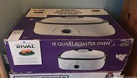 Photo of the original box for Rival 18 Quart Roaster Oven model RO180 with product image and branding.