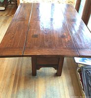 Top view of table with both leaves extended, shows wood grain, varnish and surface condition