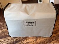Zippered rolling carry case, beige and black, with Ivation EZ-BED logo