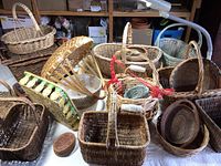 Overview photo of multiple assorted woven baskets in different shapes and sizes.