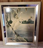 Front view of the framed Turner egret print showing the two birds by the water and detailed mirrored frame.
