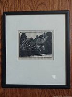 Photo of framed antique engraving of Anne Hathaways Cottage by Charles E. Flower, showing the full framed artwork on wooden floor.