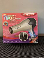 Box front showing Red by Kiss 1900 watt Tourmaline Ceramic Hair Blow Dryer with image of the dryer and attachments