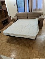 Sofabed unfolded showing the mattress extended and ready for use as a double bed.