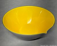 Top-down angled view showing bright yellow interior and smooth surface