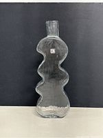 Full front view of vase showing overall wave-shaped profile