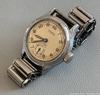 Vintage Union Special wristwatch front angled view showing dial, crown and metal expandable band with minor wear and signs of use.