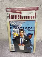 Front cover image of American Century comic book issue 1 showing the title and cover art with three characters and a map background.