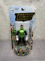 Front view of Green Lantern action figure in original Justice League of America Series 3 packaging, sealed and new.