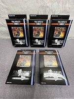 Five unopened boxed Final Fantasy IX Trading Card Game Starter Sets by Square Enix, arranged with three standing in the back and two lying face up in front, showing front of packaging with character artwork visible.