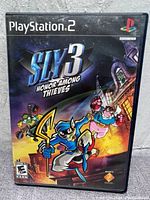 Front cover of Sly 3: Honor Among Thieves PlayStation 2 game showing illustrated characters and game title.