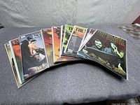 Eight Stephen King comic books spread and stacked on a fabric surface, showing various cover art and titles.