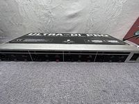 Front panel view showing four XLR outputs and 1/4 inch inputs with channel controls and indicators.