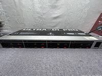 Front view of Ultra-DI Pro 4-channel DI box front panel showing inputs, controls, and branding.