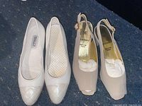 Three pairs of shoes placed side by side: white Bally flats, beige Bruno Magli slingback heels with open toes and modest heel.