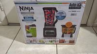 Photo of original box showing Ninja Professional Plus Kitchen System with images and branding