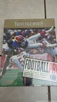 Front cover of boxed 1993 Front Page Sports Football Pro game showing football players in action and game title.