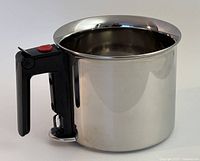 Front angle view of BEKA stainless steel double boiler pot showing polished exterior and black handle with red button.