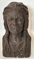Front view of the detailed bust showing facial features and braids.